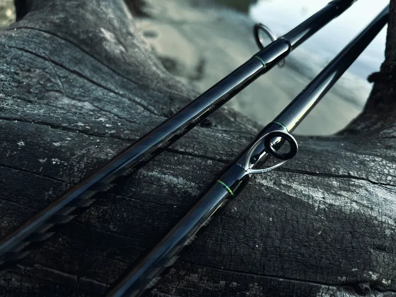 Fishing rods resting on a log