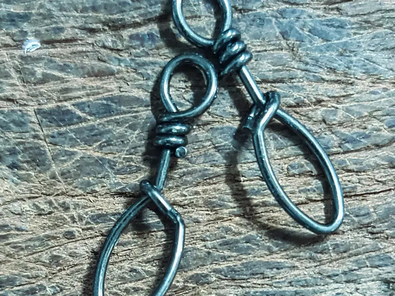 Snap clips and swivels on a rock