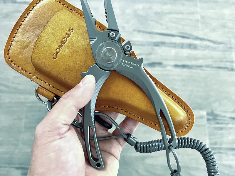 Angler using fishing pliers